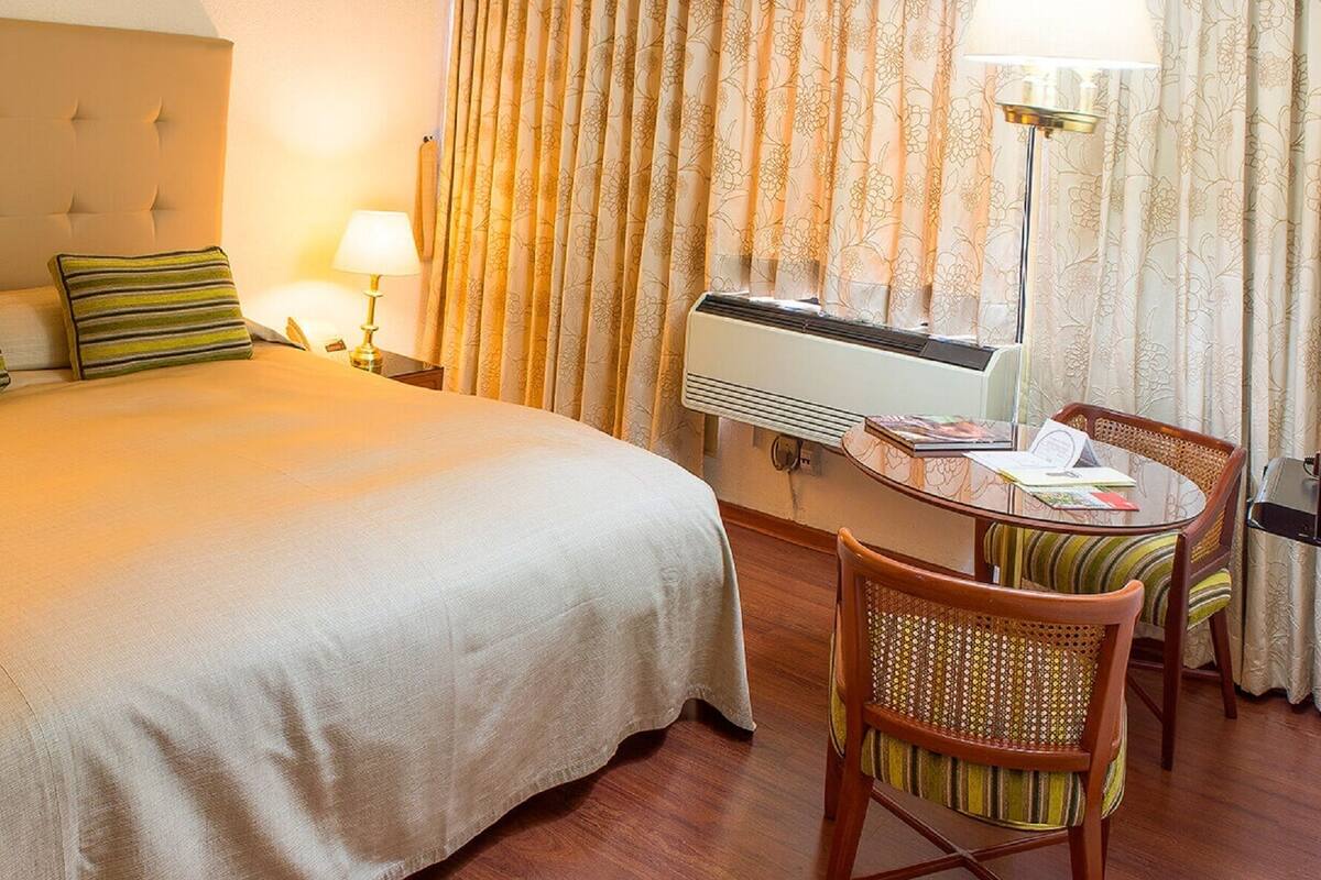 Standard Double Room | Minibar, in-room safe, desk, iron/ironing board