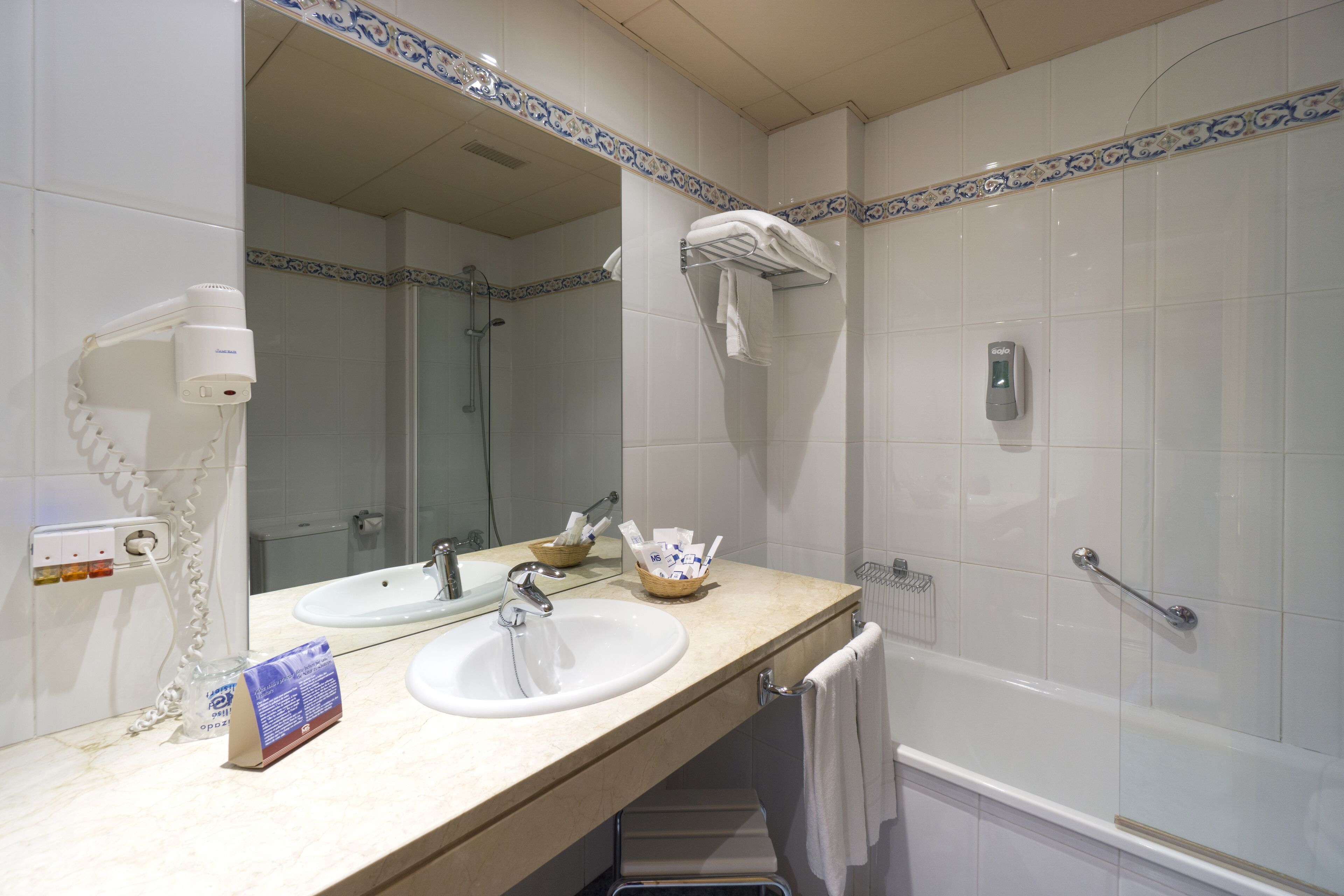 hair dryer, bidet, towels, soap