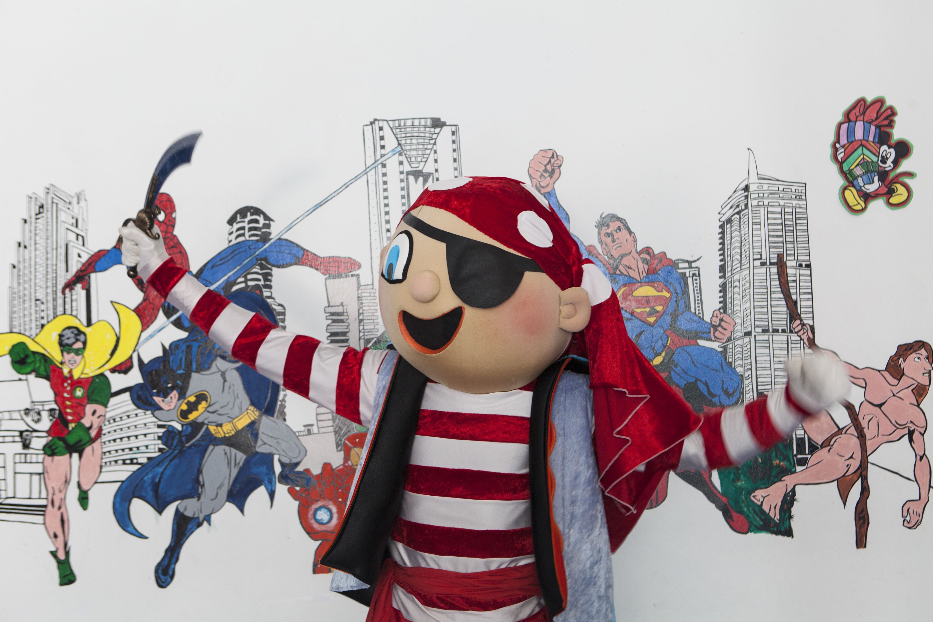 A person in a superhero costume with a cityscape background.