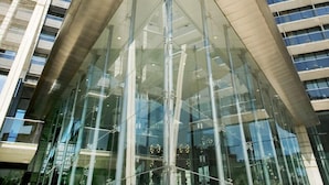 A modern building with a prominent glass facade and a unique angular design. - Gran Hotel Bali (Benidorm)