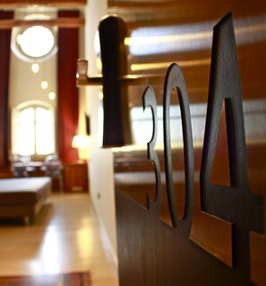 A close-up of a metal sign with the numbers "304" in a restaurant setting.