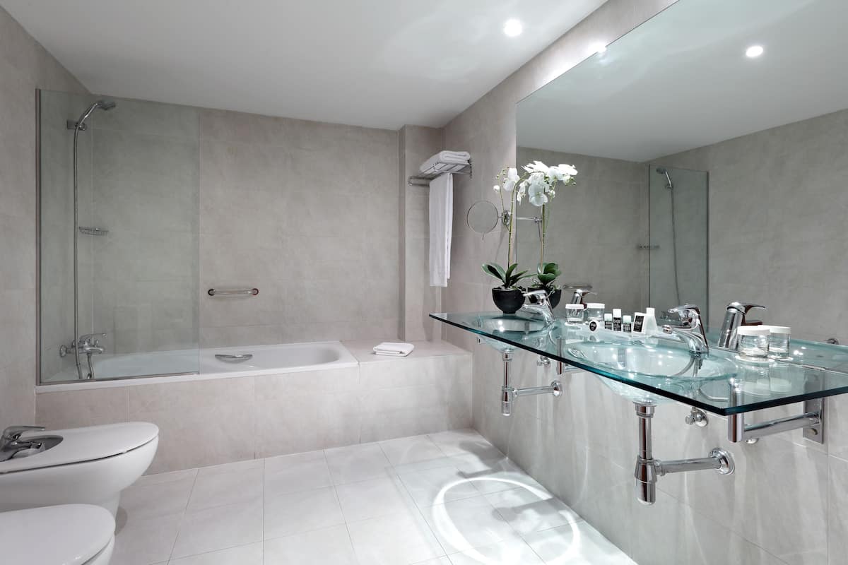 double room single use | bathroom | deep-soaking bathtub, eco-friendly toiletries, hair dryer, towels