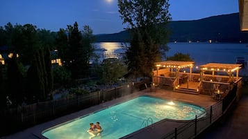 Seasonal outdoor pool, open 10:00 AM to 8:00 PM, pool umbrellas