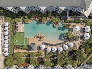 An aerial view of a resort with a central swimming pool, multiple lounge areas, and a landscaped garden. - Mantra on Salt Beach (Kingscliff)