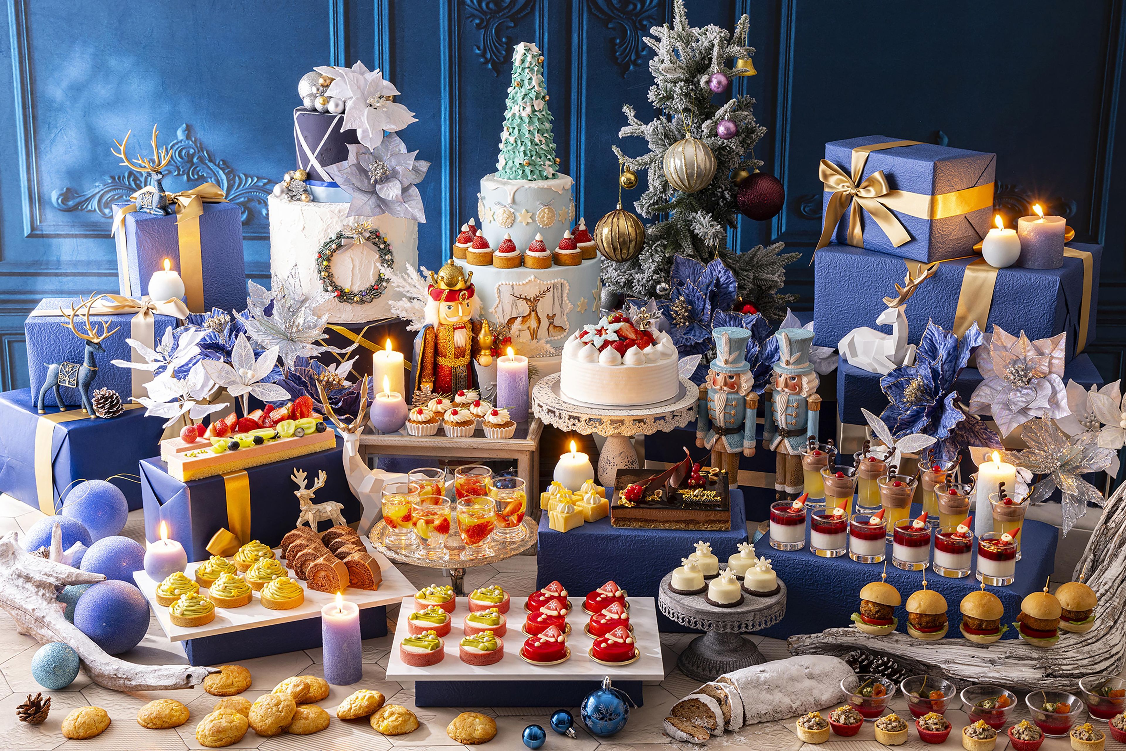 A festive display with various desserts, cakes, and gift boxes, suggesting a celebration or event.