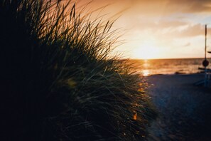Beach nearby, white sand, beach volleyball, beach bar