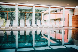 Indoor pool, open 7:00 AM to 10:00 PM, pool loungers