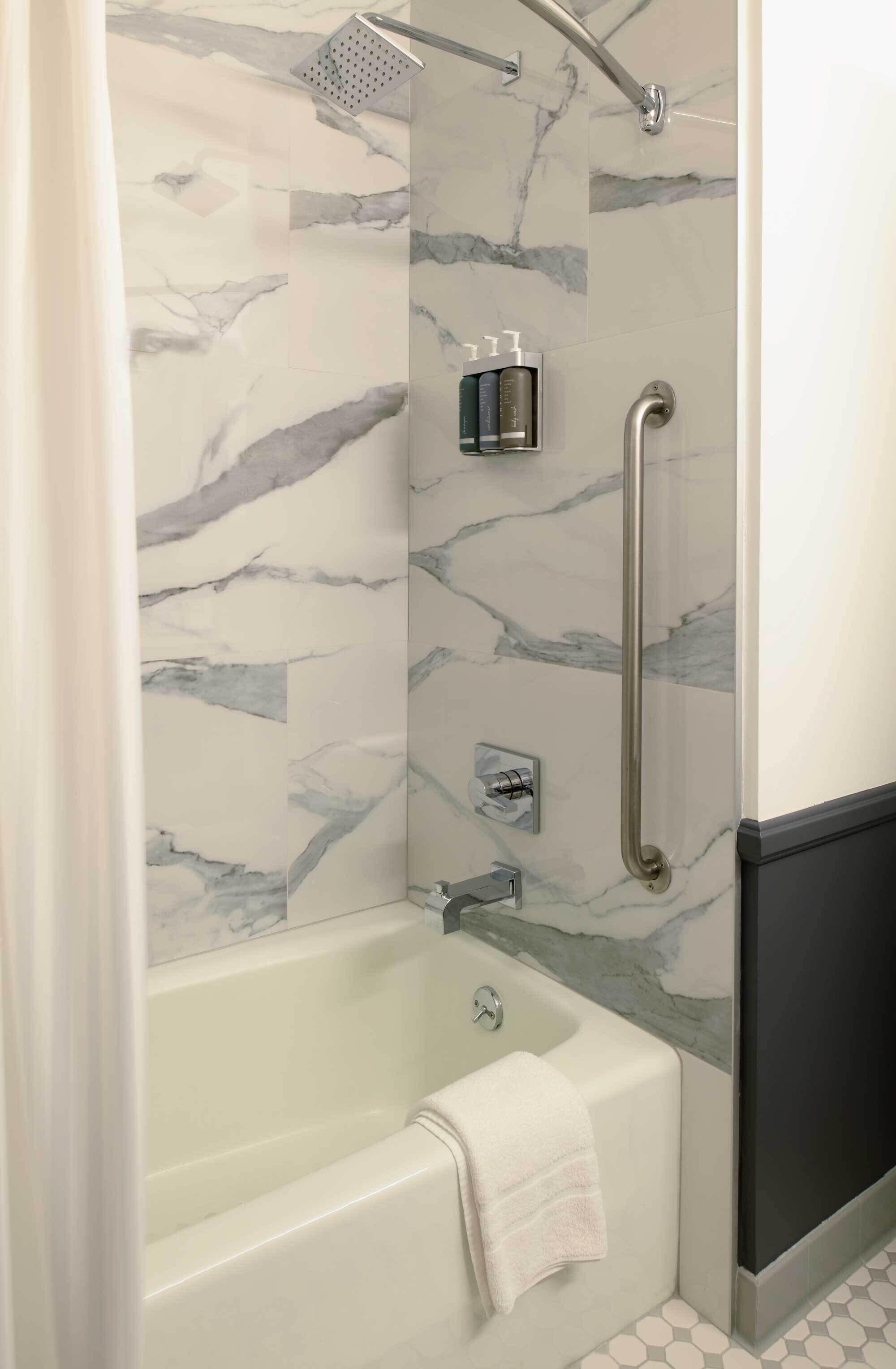 combined shower/bathtub, free toiletries, hair dryer, towels