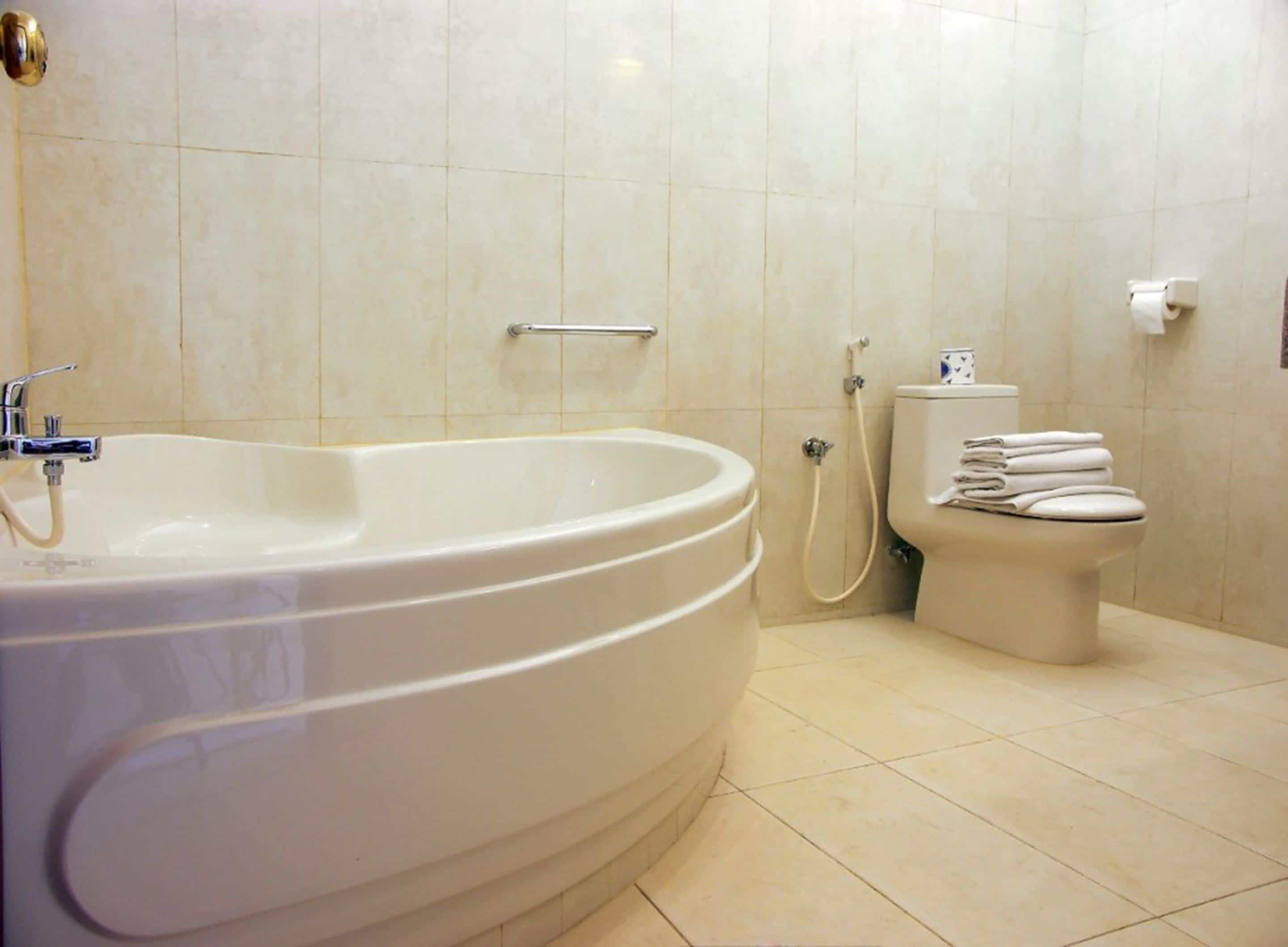 hair dryer, slippers, bidet, towels