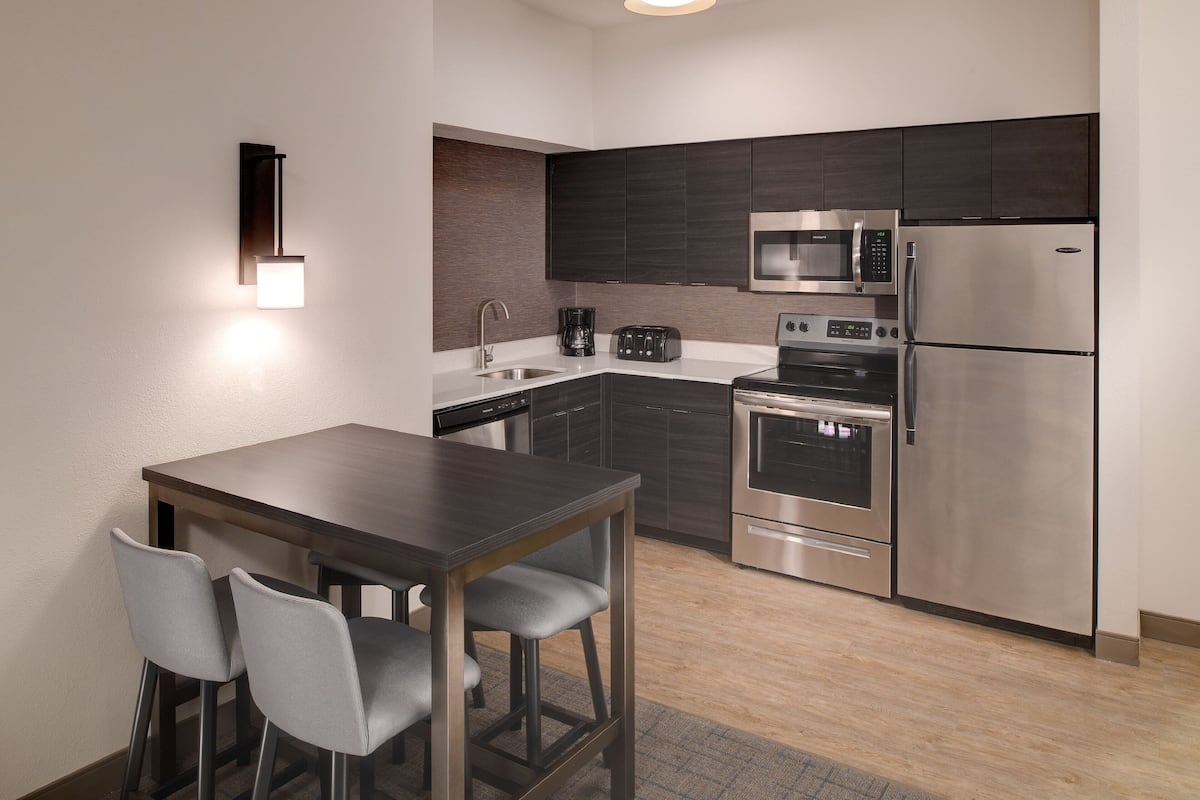 full-sized fridge, microwave, stovetop, dishwasher