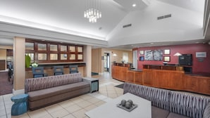 A spacious lobby with a reception desk, seating areas, and a modern chandelier. - Residence Inn by Marriott Wichita East at Plazzio (Wichita)