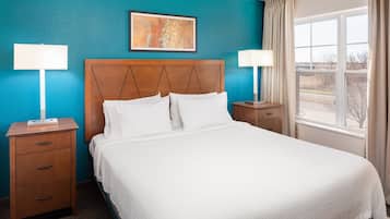 Premium bedding, desk, laptop workspace, blackout curtains