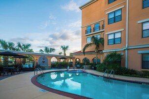 Outdoor pool, open 7:00 AM to 10:00 PM, pool umbrellas, sun loungers