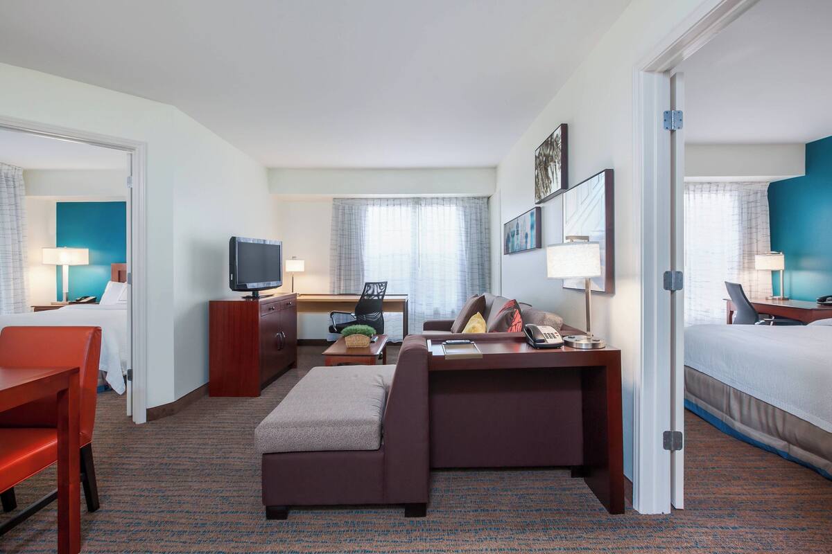 suite, 2 bedrooms, balcony | 1 bedroom, desk, blackout curtains, iron/ironing board