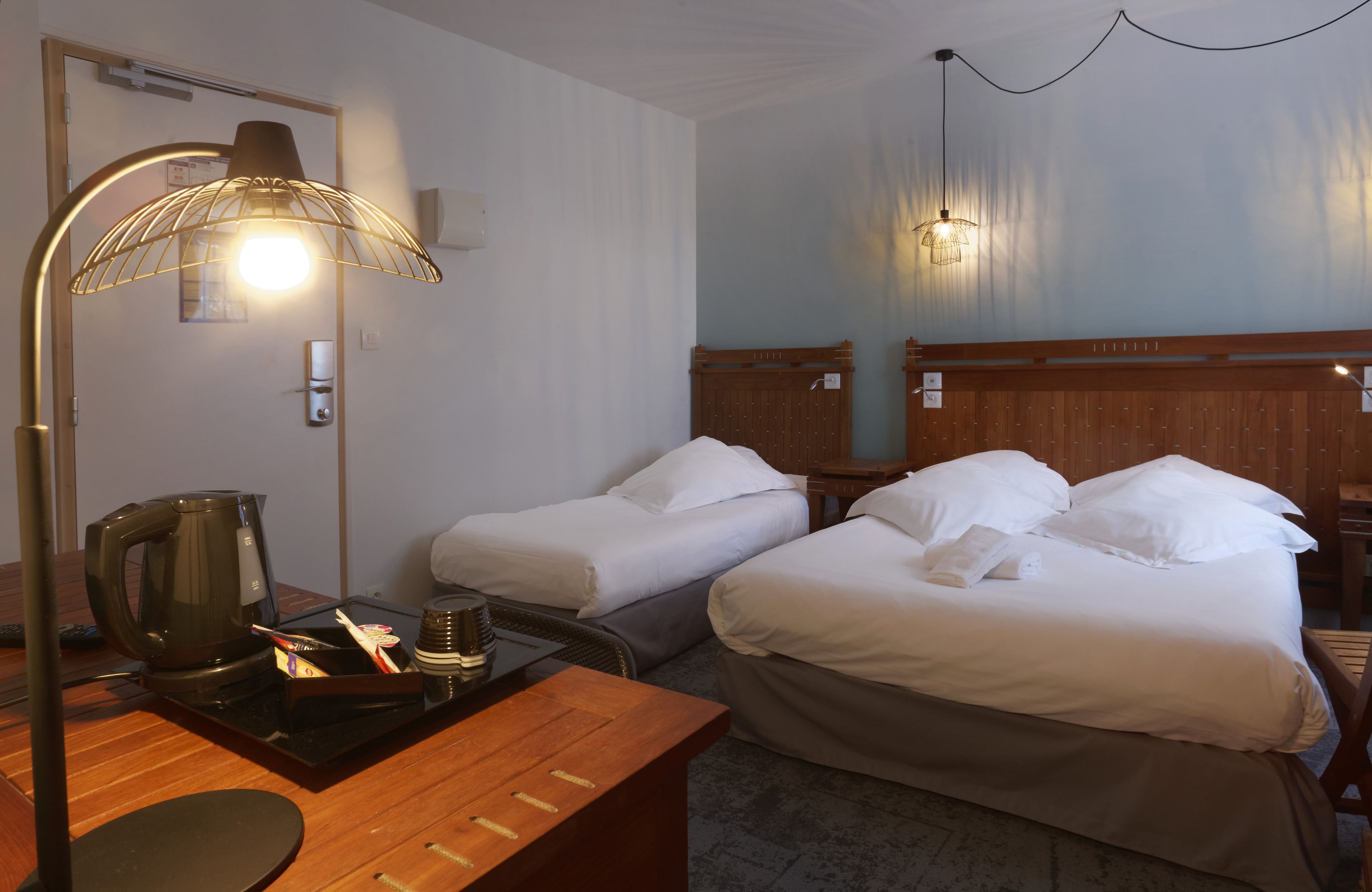 standard triple room, garden view | premium bedding, minibar, in-room safe, desk