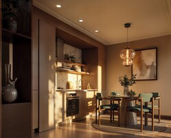 A modern kitchen with built-in appliances, a dining area with a round table and chairs, and a pendant light.