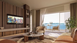 Ein modernes Wohnzimmer mit Fernseher, rundem Couchtisch, Sofa und Balkon mit Meerblick.