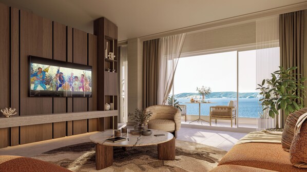 A modern living room with a TV, a round coffee table, a sofa, and a balcony with a view of the sea.