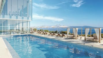 Seasonal outdoor pool, pool umbrellas, pool loungers