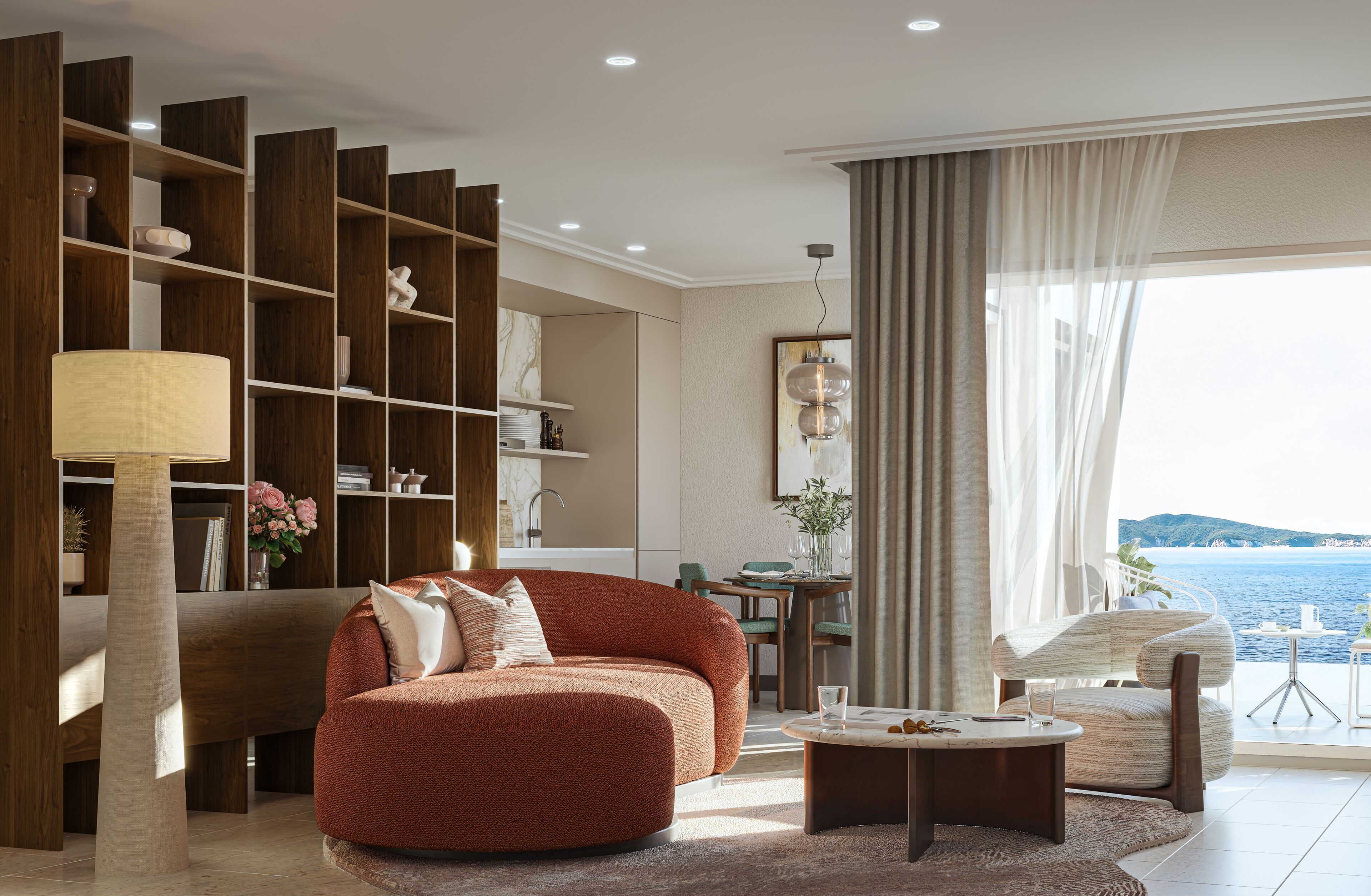 Una sala de estar moderna con un sofá, una mesa de centro y vistas al mar.
