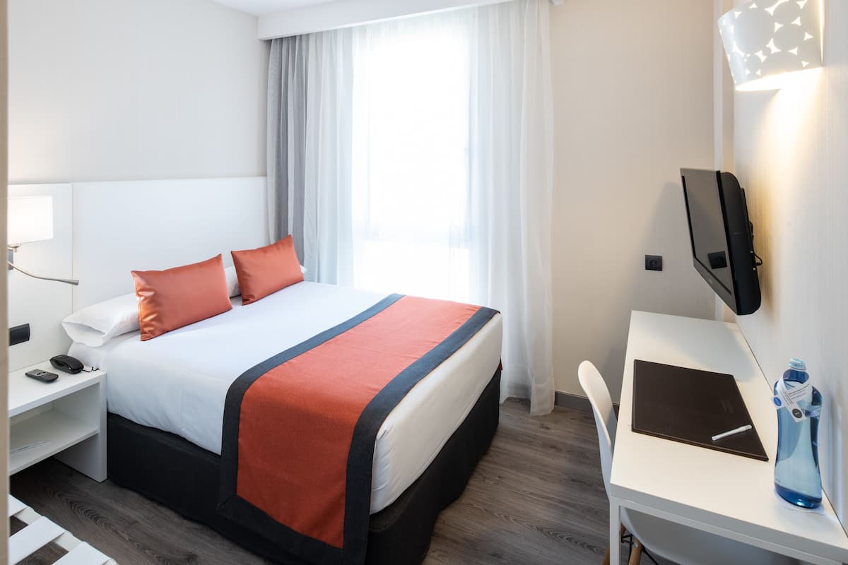 Habitación individual | Minibar, caja fuerte, sistema de insonorización y wifi gratis