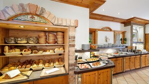 A buffet area with various food items and baskets.