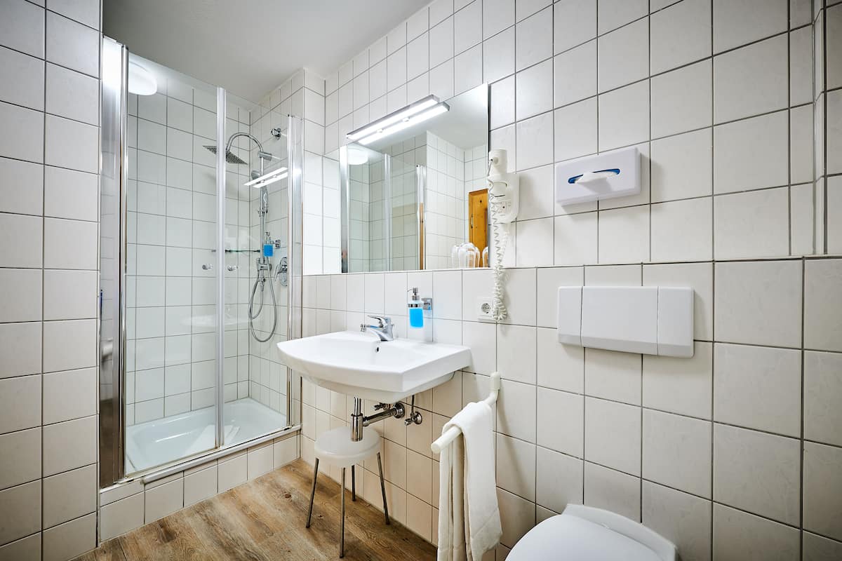 shower, hair dryer, bathrobes, towels