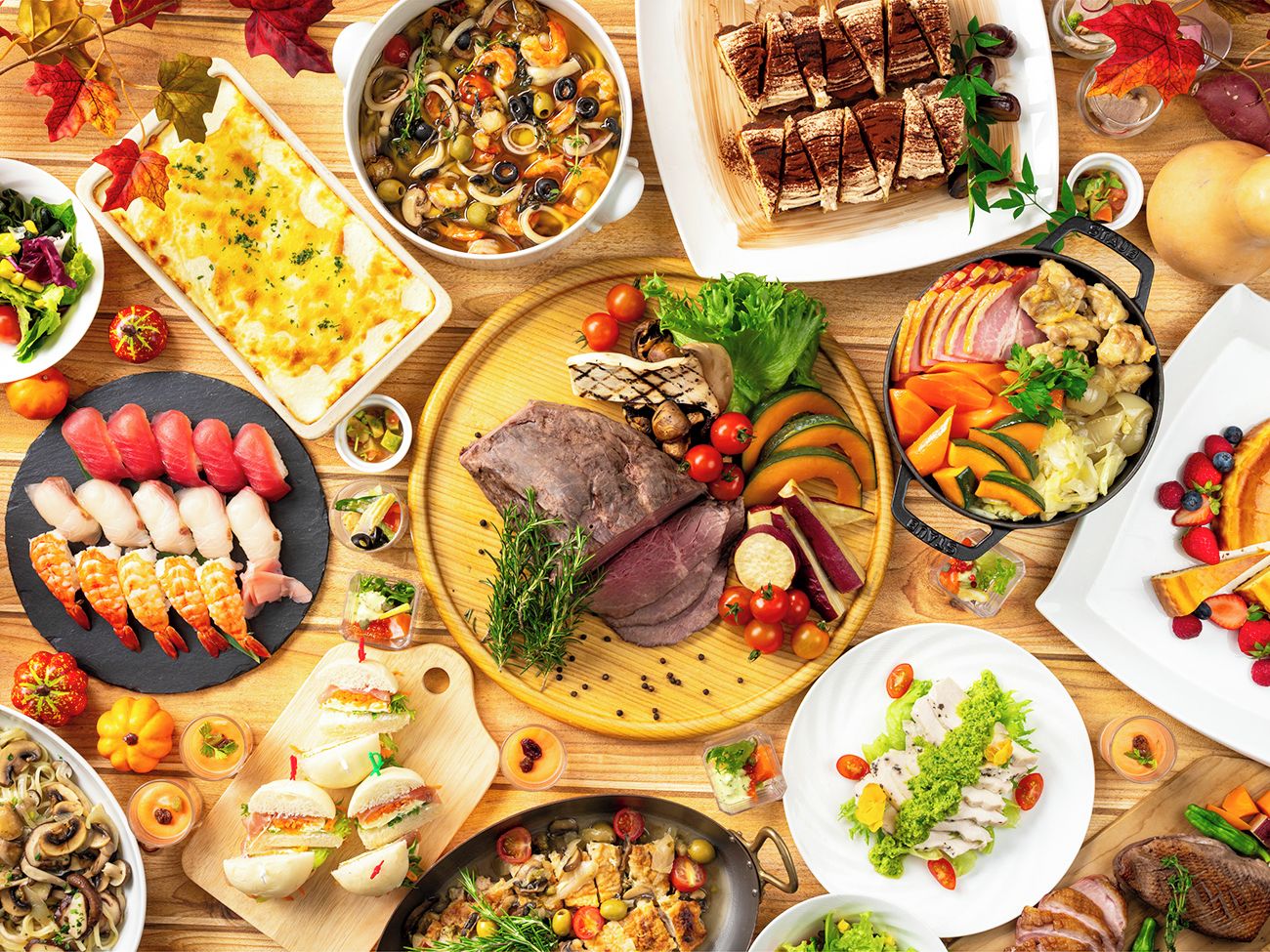 A variety of dishes including seafood, meats, and vegetables, suggesting a diverse meal selection.