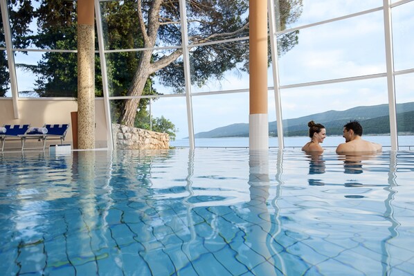Indoor pool, outdoor pool, pool umbrellas, pool loungers