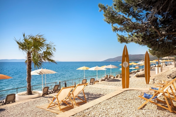 On the beach, snorkeling, water skiing, beach volleyball