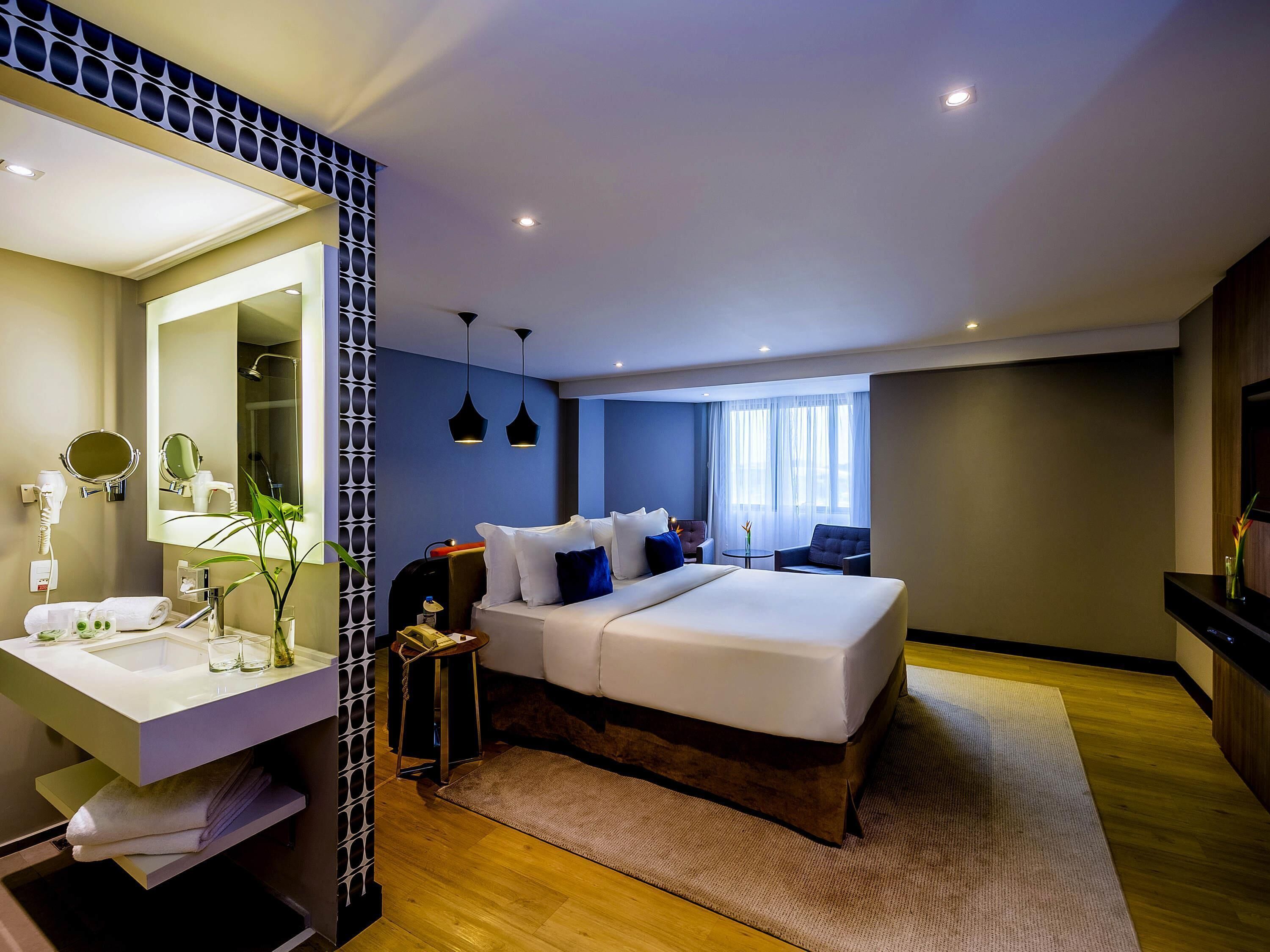 Chambre Deluxe, 1 lit double | Literie de qualité supérieure, minibar, coffres-forts dans les chambres