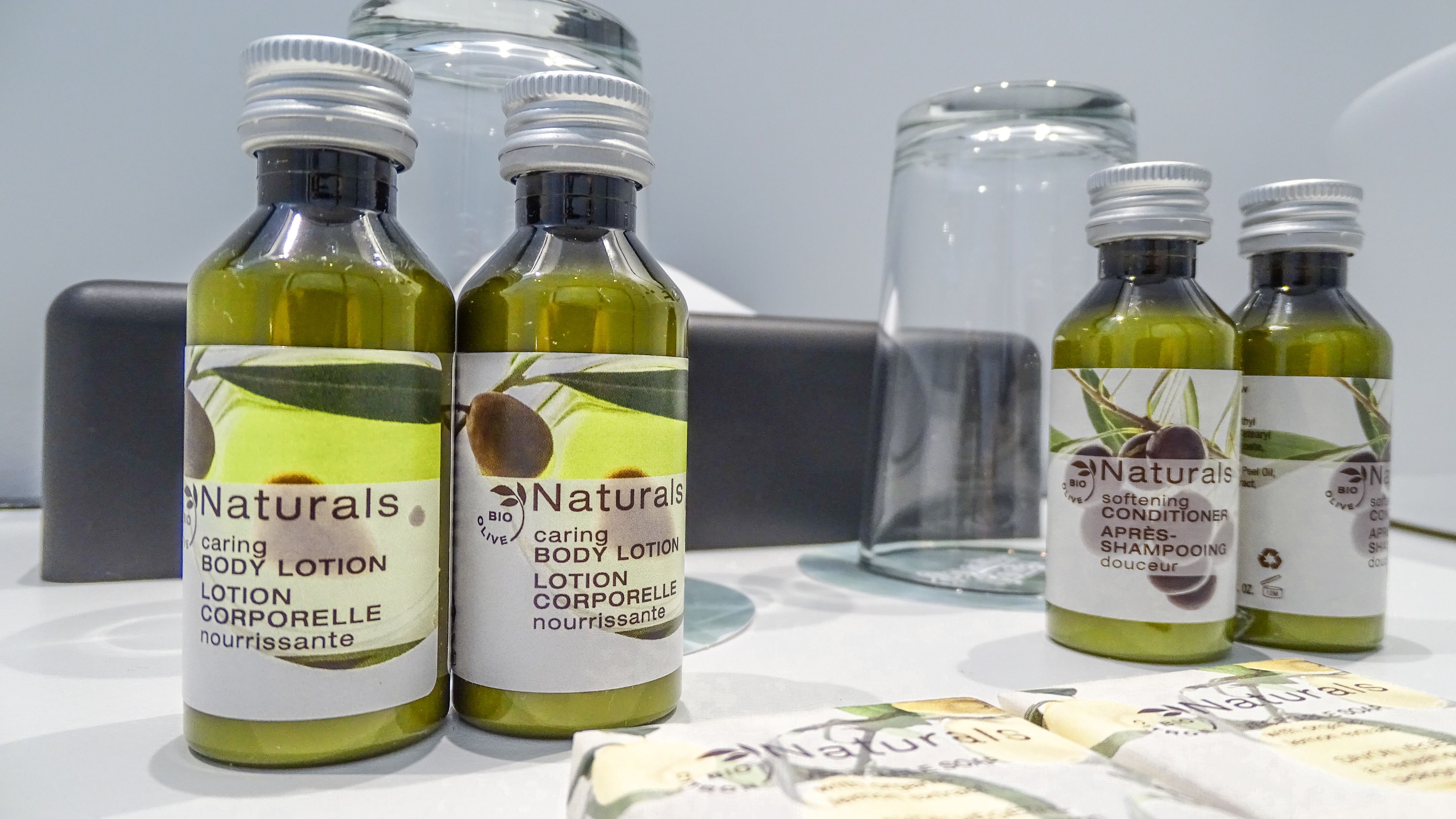 designer toiletries, hair dryer, towels