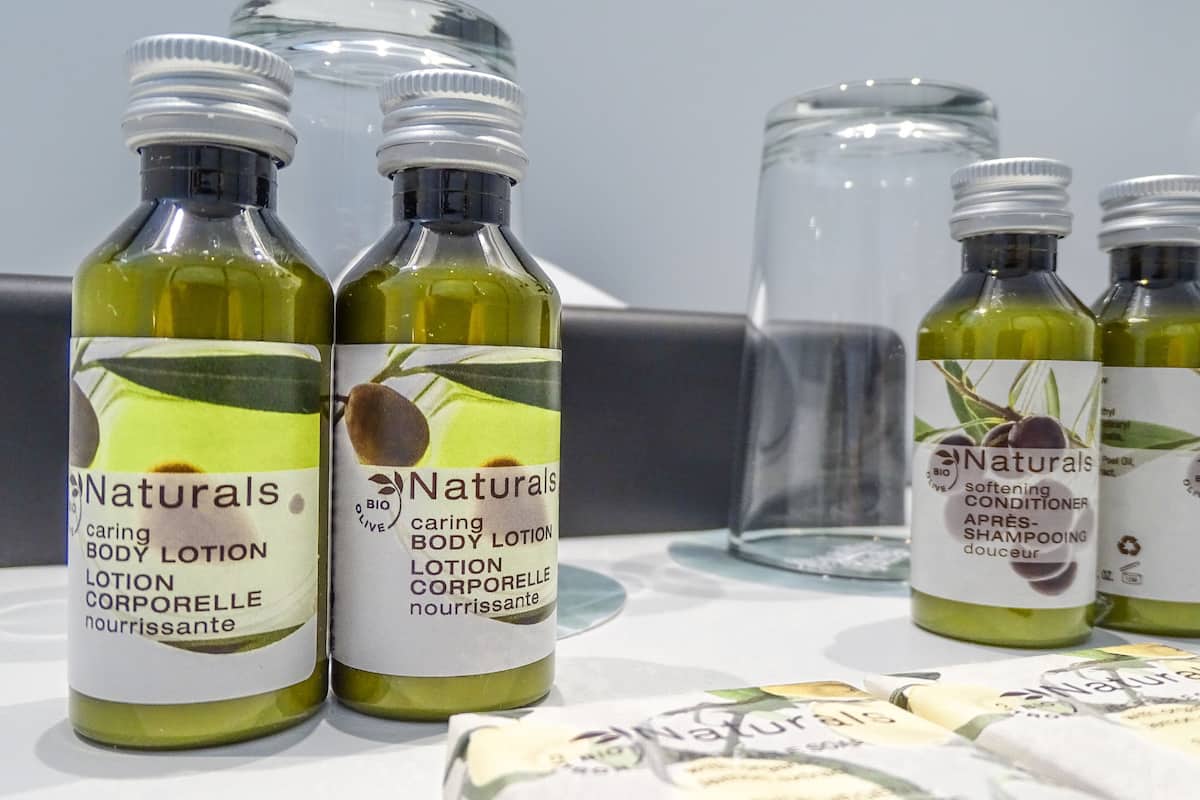 designer toiletries, hair dryer, towels