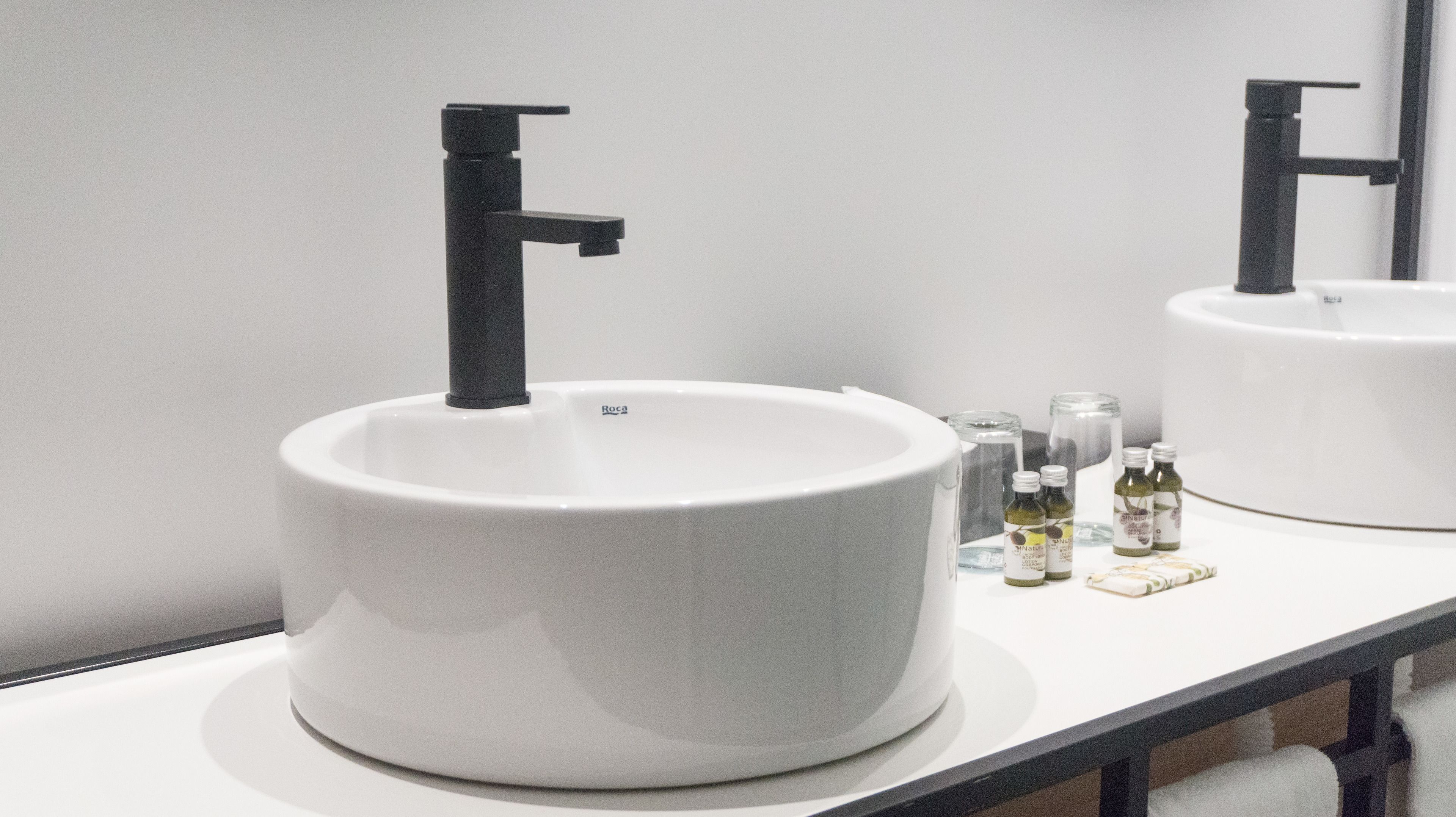 designer toiletries, hair dryer, towels