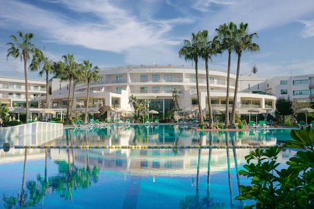 Outdoor pool, pool umbrellas, sun loungers. AGADIR BEACH CLUB HOTEL