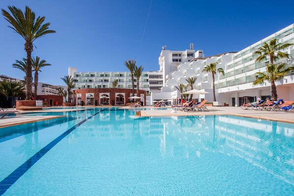 Outdoor pool, open 8:00 AM to 7:00 PM, pool umbrellas, pool loungers