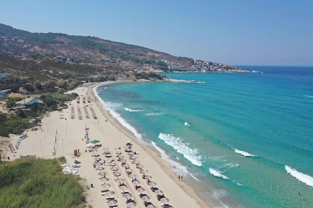 Beach nearby, beach umbrellas. Ikaros Star Hotel