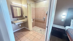 Standard Room, 1 King Bed, Roll-in Shower | Bathroom | Combined shower/tub, free toiletries, hair dryer, towels