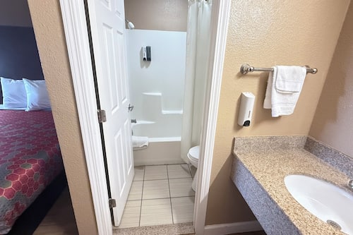 Standard Room, 2 Queen Beds, Non Smoking | Bathroom | Combined shower/bathtub, free toiletries, hair dryer, towels