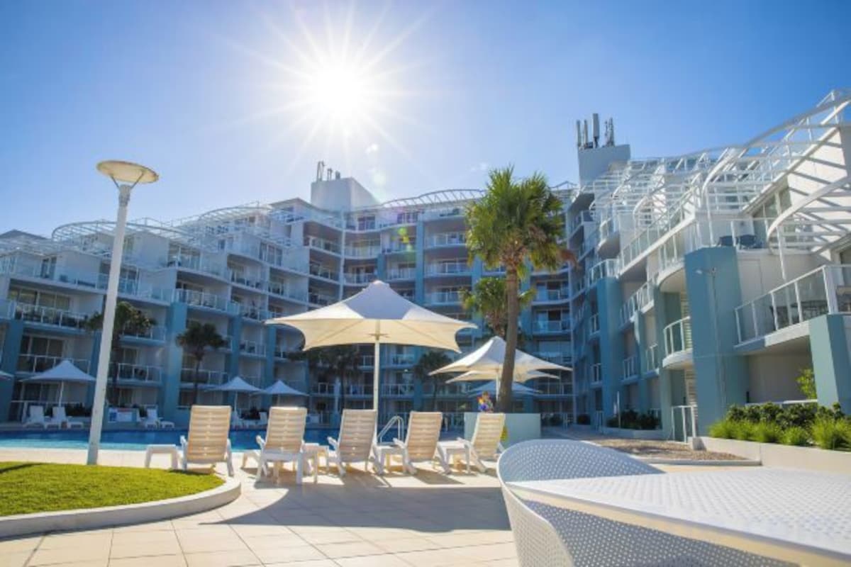 Outdoor pool, pool umbrellas, sun loungers