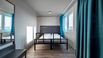 Relax in a spacious room with a large bed and comfortable seating area.