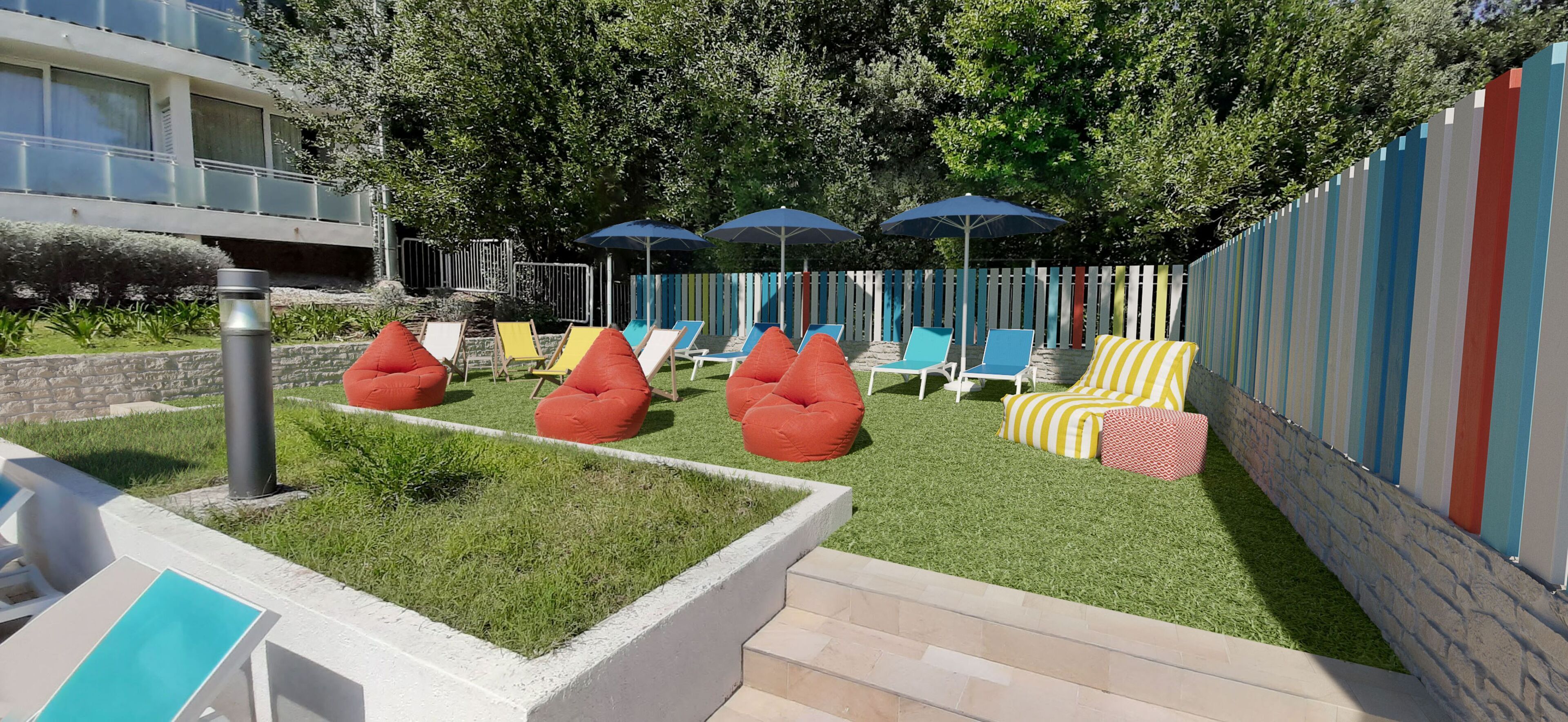 A garden area with outdoor seating, including chairs and bean bags, and a water fountain.