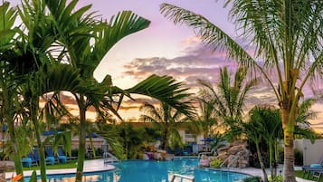 Outdoor pool, a heated pool, open 8 AM to 10 PM, pool umbrellas