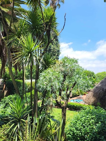 Deluxe Room, 1 Bedroom, Pool View | Garden view. Margaret's Place