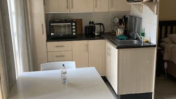 Deluxe Room, 1 Bedroom, Pool View | Private kitchen | Full-size fridge, microwave, oven, stovetop