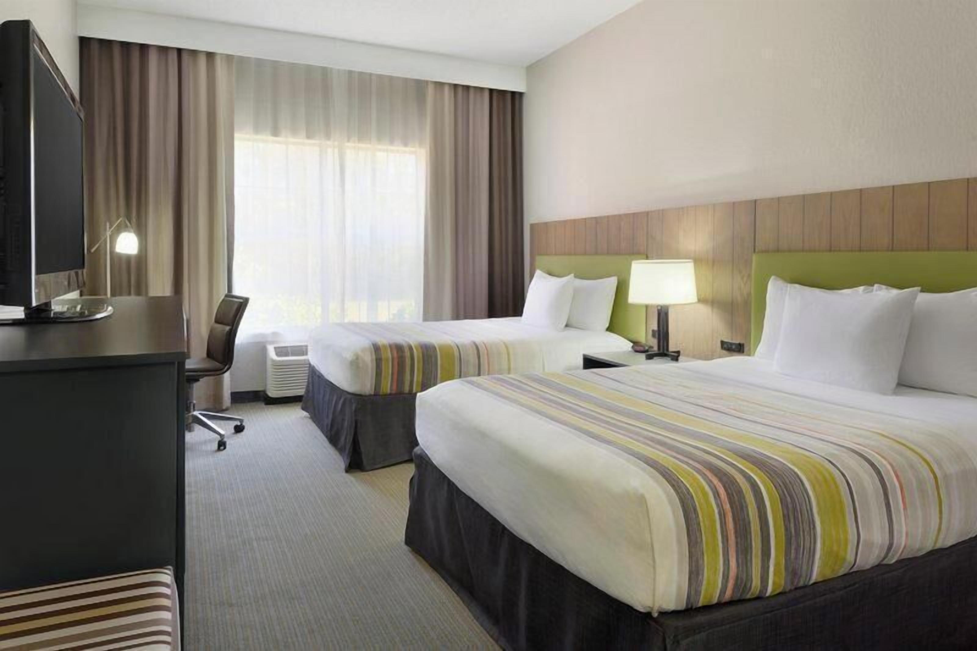 Premium bedding, down duvets, pillow-top beds, in-room safe
