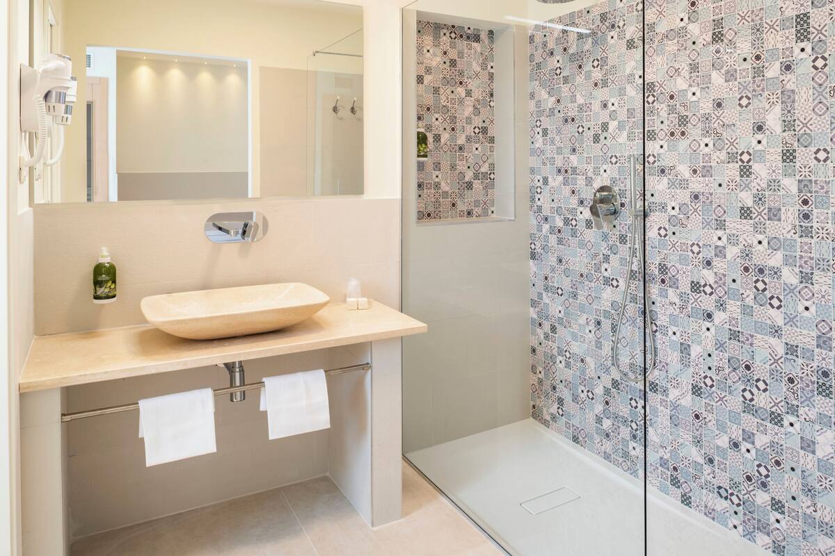 romantic suite | bathroom | eco-friendly toiletries, hair dryer, bidet, towels