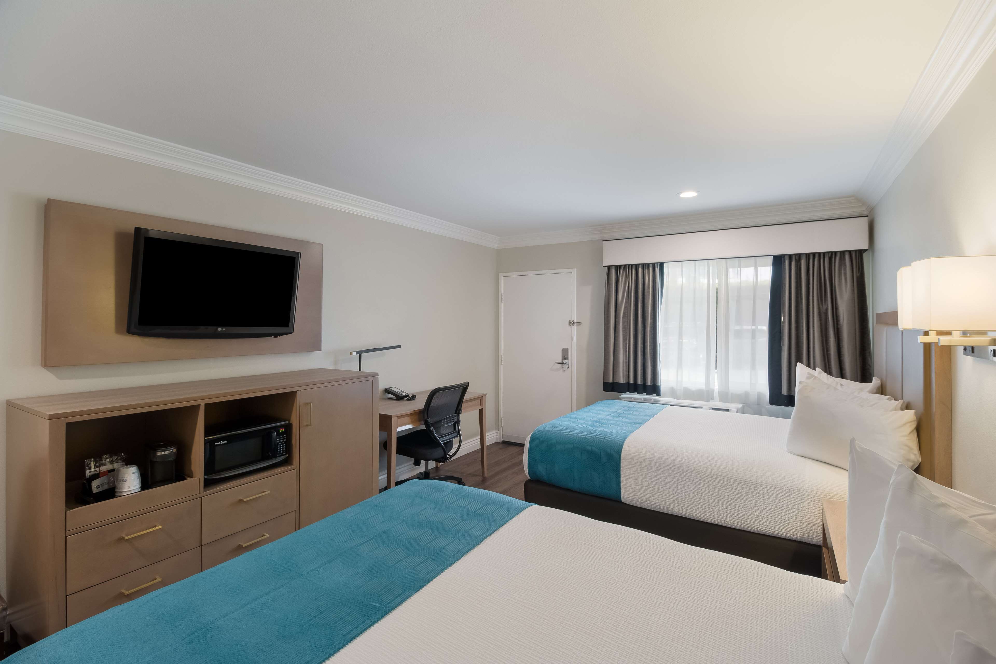 standard room, 2 queen beds, non smoking, refrigerator & microwave | 1 bedroom, premium bedding, desk, blackout curtains