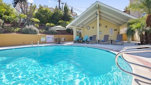 Outdoor pool, open 9 AM to 9 PM, pool loungers
