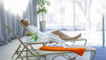 Relax in comfort with a sun lounger, bathrobe, and refreshing drinks at your fingertips.
